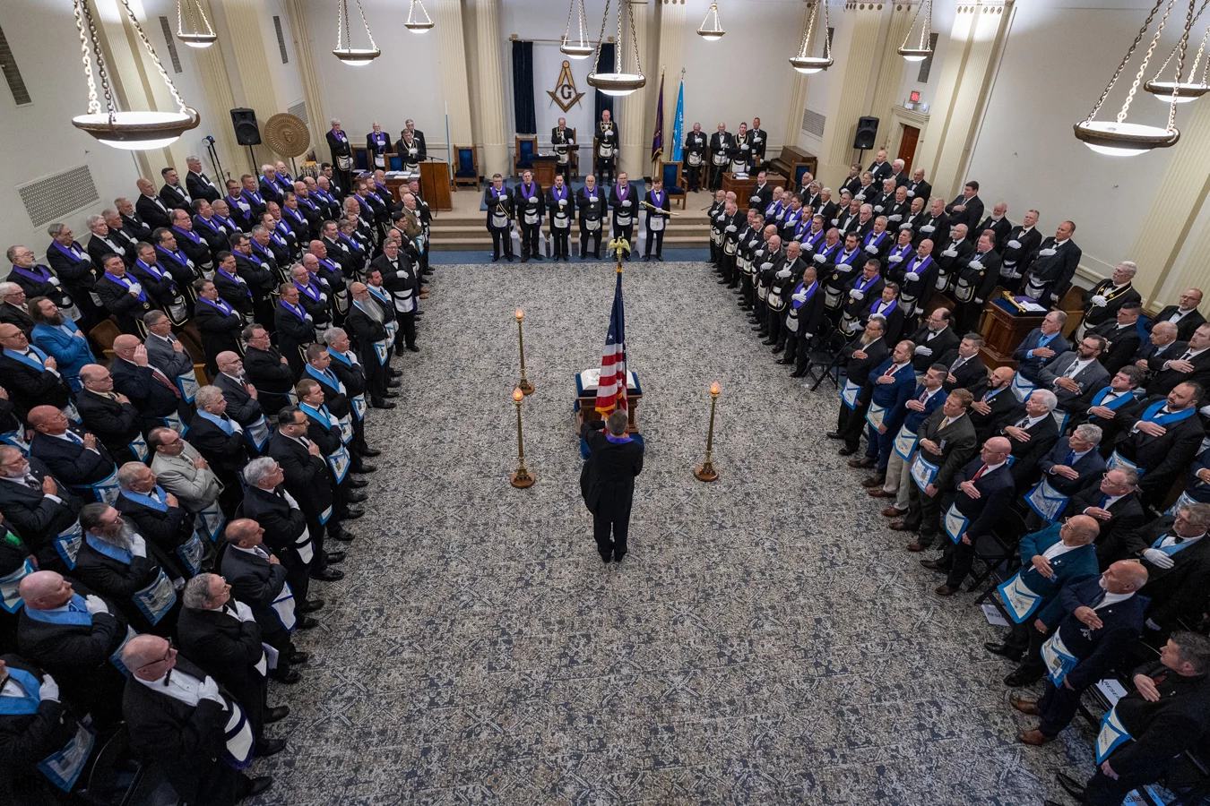 DSC06600 Group of Masons standing in lodge room.