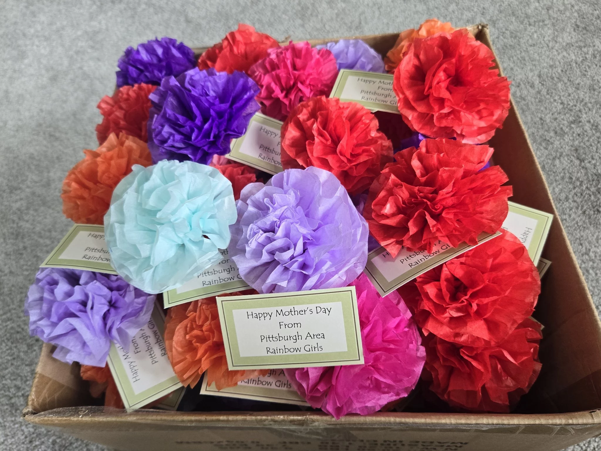 Rainbow Sewickley Service Project – Flowers Closeup of paper flowers with notes that read "Happy Mother's Day from Pittsburgh Area Rainbow Girls"