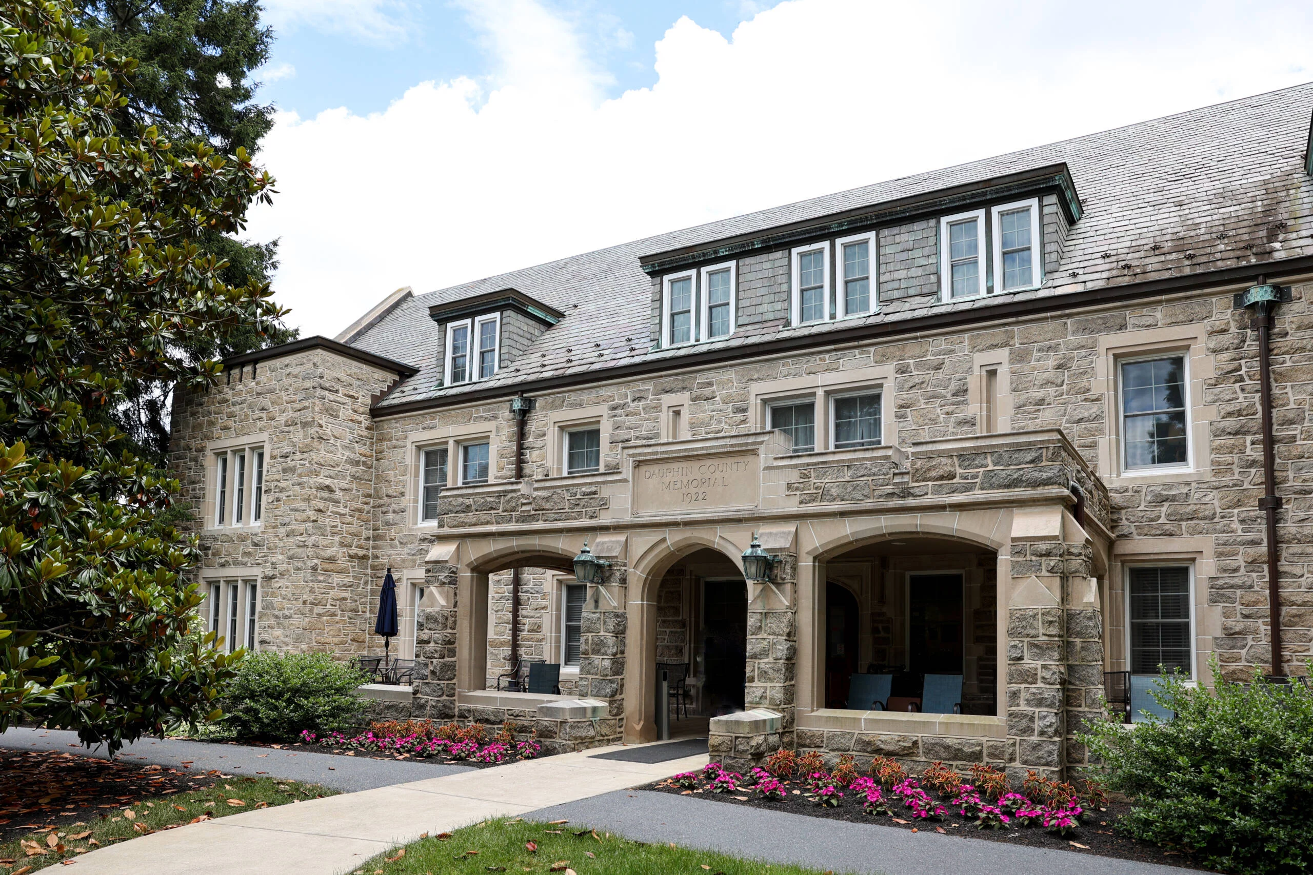 1W8A3948_Dauphin2024-scaled Wide angle of stone building with gardens in front.