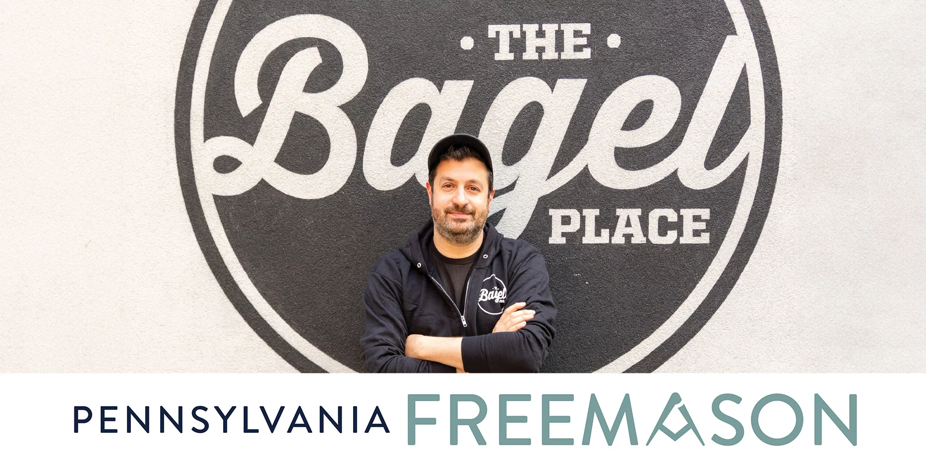 Cover of Summer 2024 Freemason featuring man with crossed arms standing in front of The Bagel Place logo.