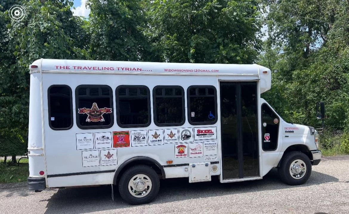 Wide shot of Widows' Sons bus.
