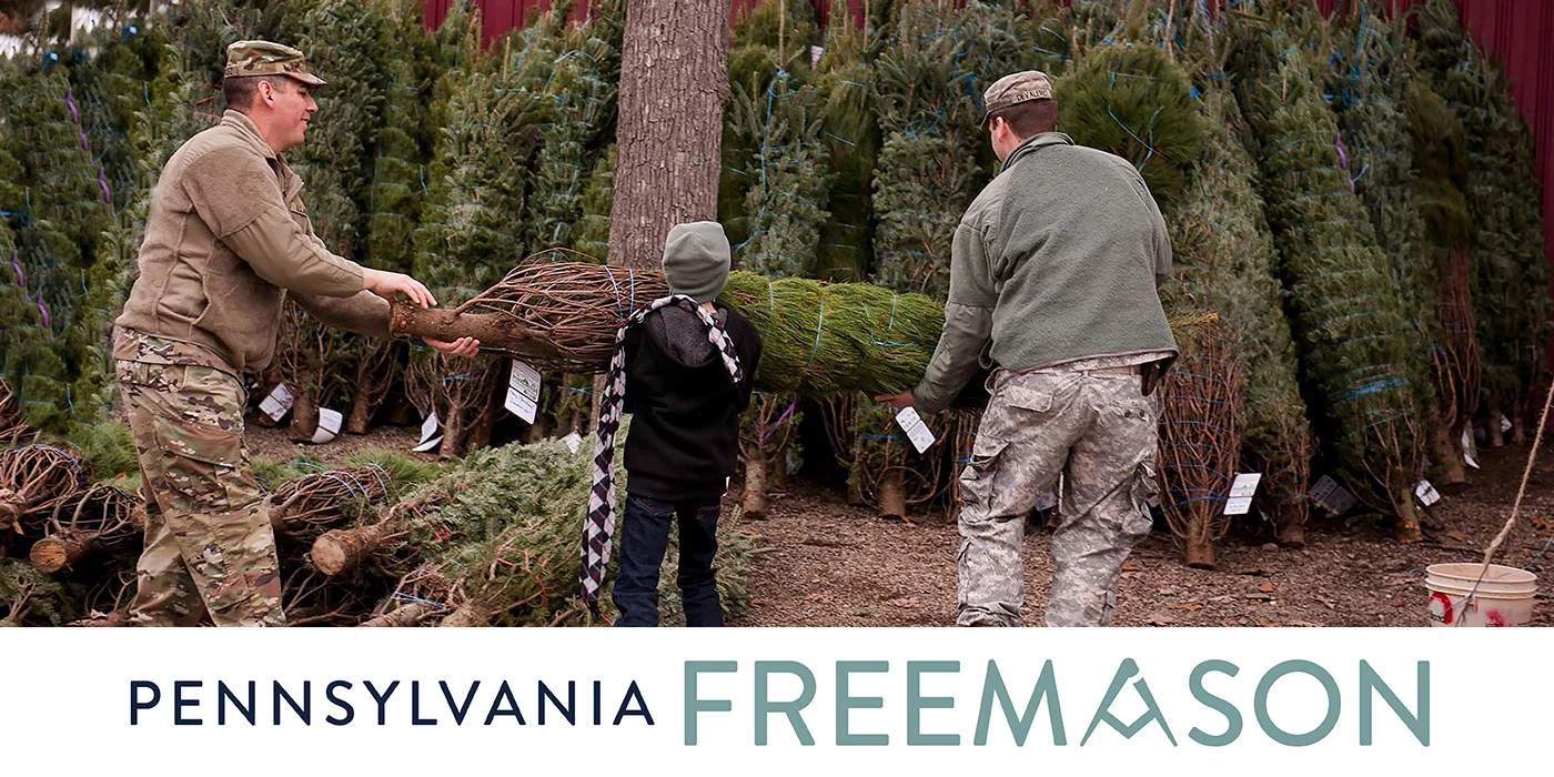 Cover of Autumn 2024 Freemason featuring men and boy caring evergreen tree.