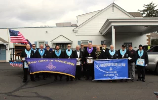 Group of Masons holding parade banners.