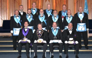 Group of men dressed in Masonic regalia.