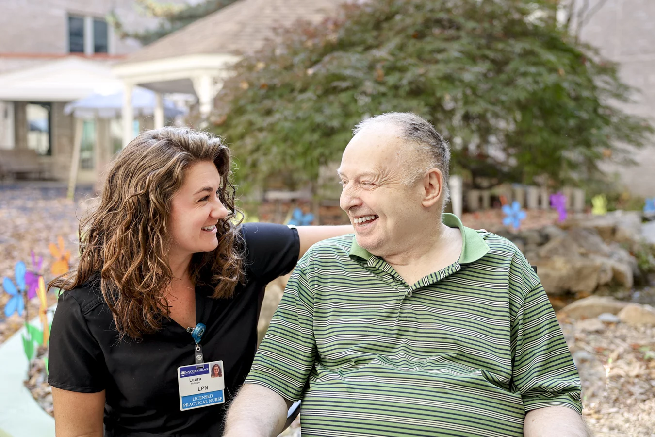 Smiling man with LPN outdoors.