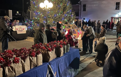 59-2 Table and Christmas tree set up outside of lodge building.