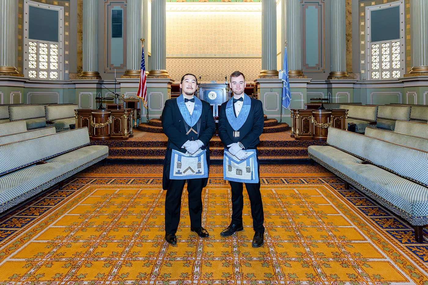 Two young men standing together in Masonic Temple.