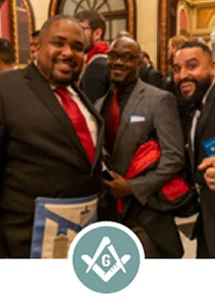 Smiling men in Masonic dress with square and compass icon.