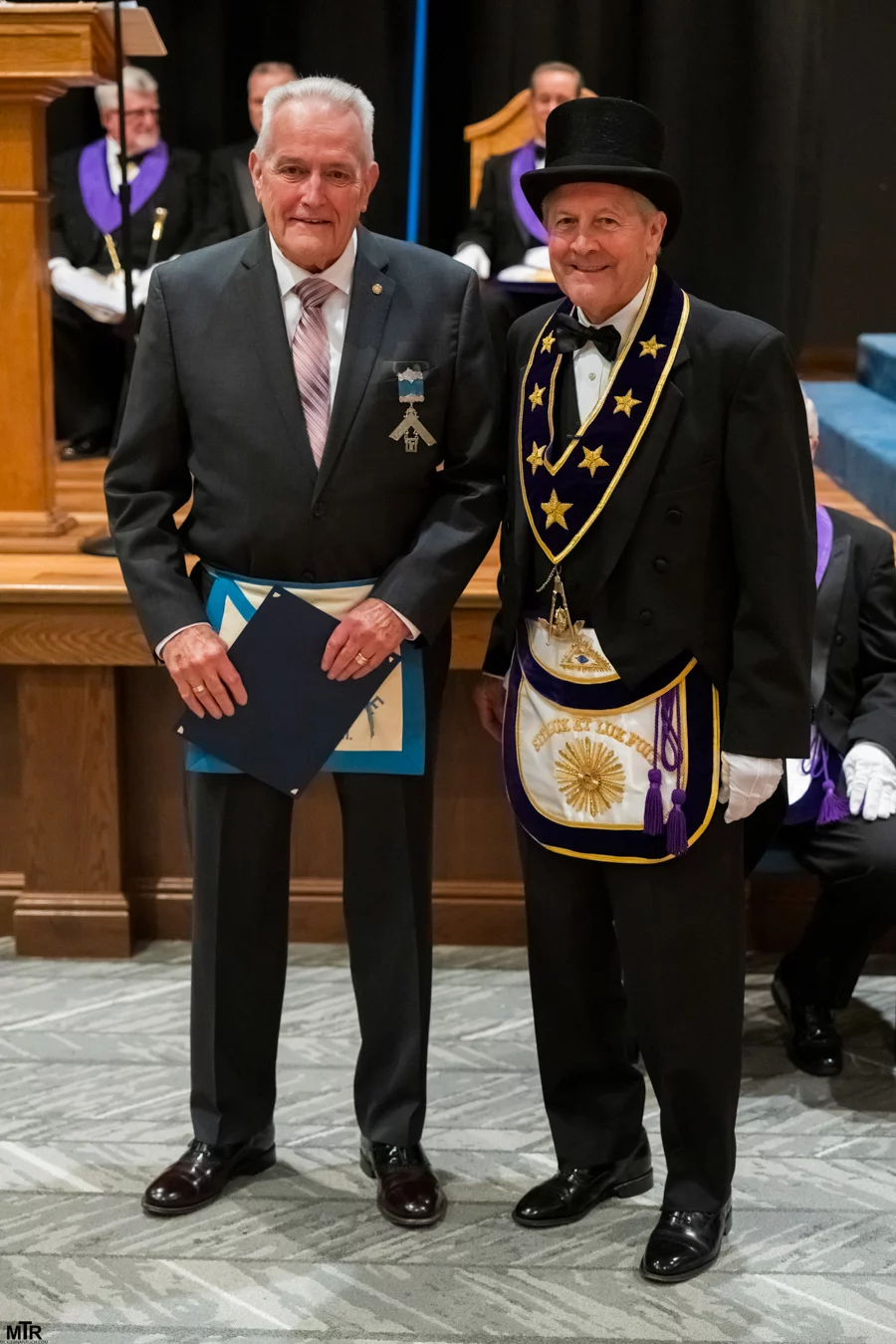 1000037275 Men standing dressed in Masonic regalia.