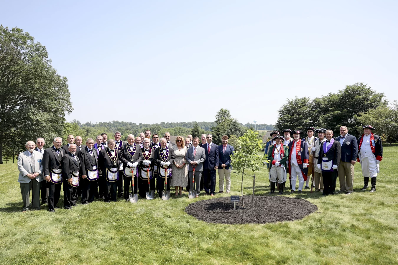 1W8A0746 Group standing around newly planted liberty tree,