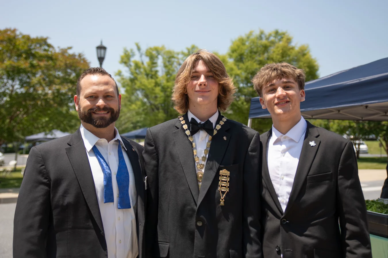 2V9A4876 Group of young men smiling and standing together.