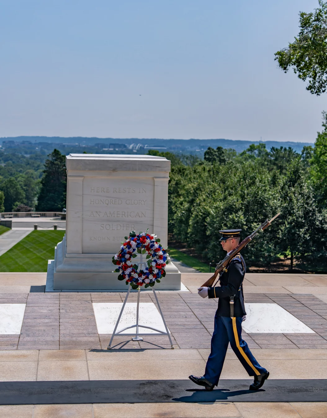 _7R50115 Man in military dress walking in front of the Tomb of the Unknown Soldier.