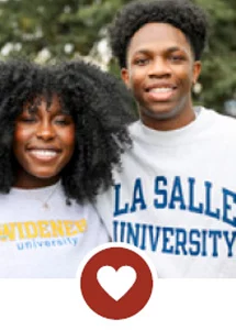 Smiling teens wearing college sweatshirts with heart icon.