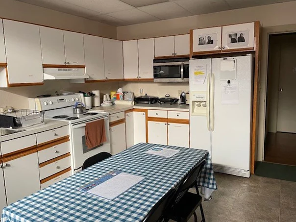 Kitchen with large table in the center.