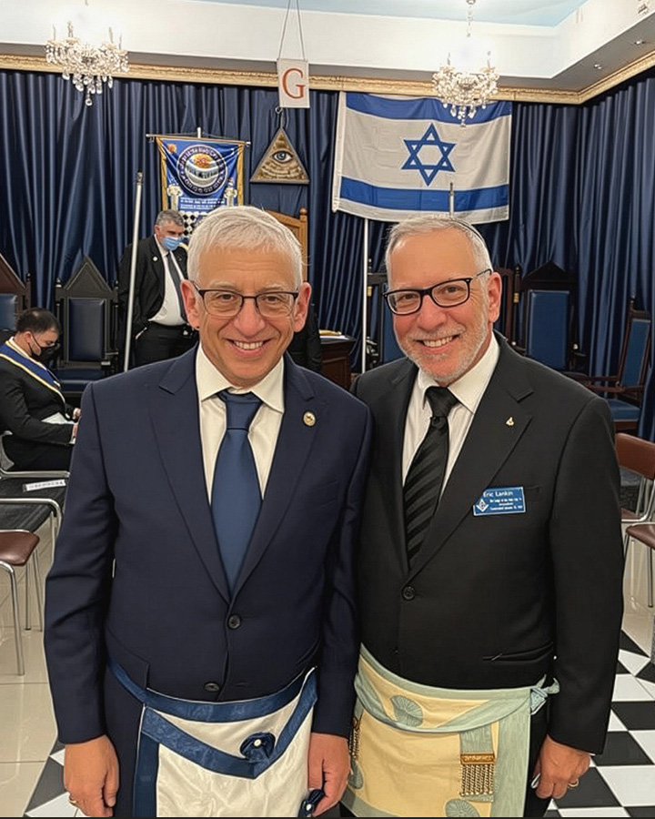 Two men standing in lodge room