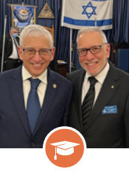 Two men standing together smiling with education icon