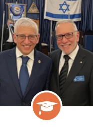 Two men standing together smiling with education icon