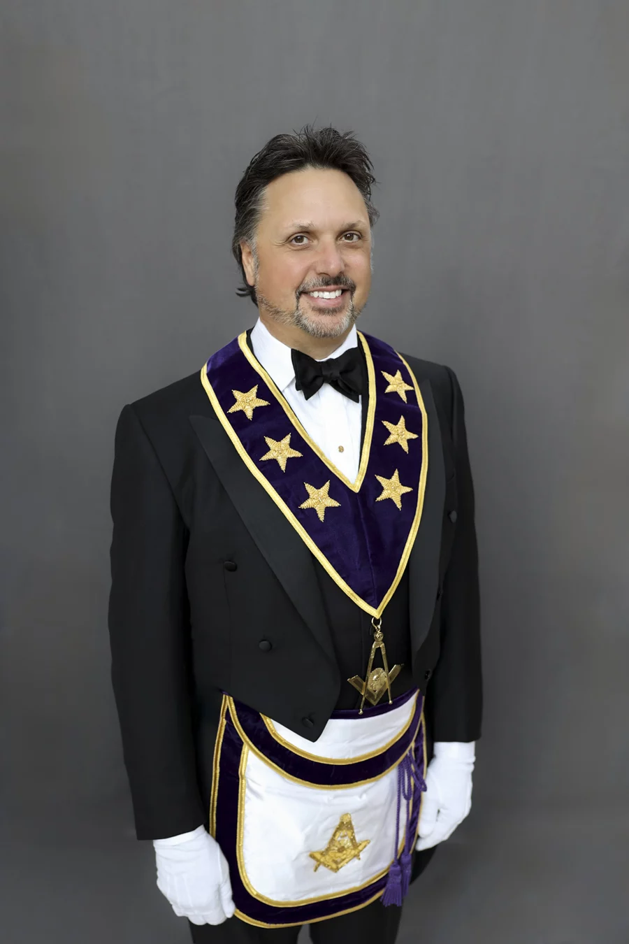1W8A4781-Edit Man with short dark hair and beard dressed in Masonic Grand Lodge Officer attire.