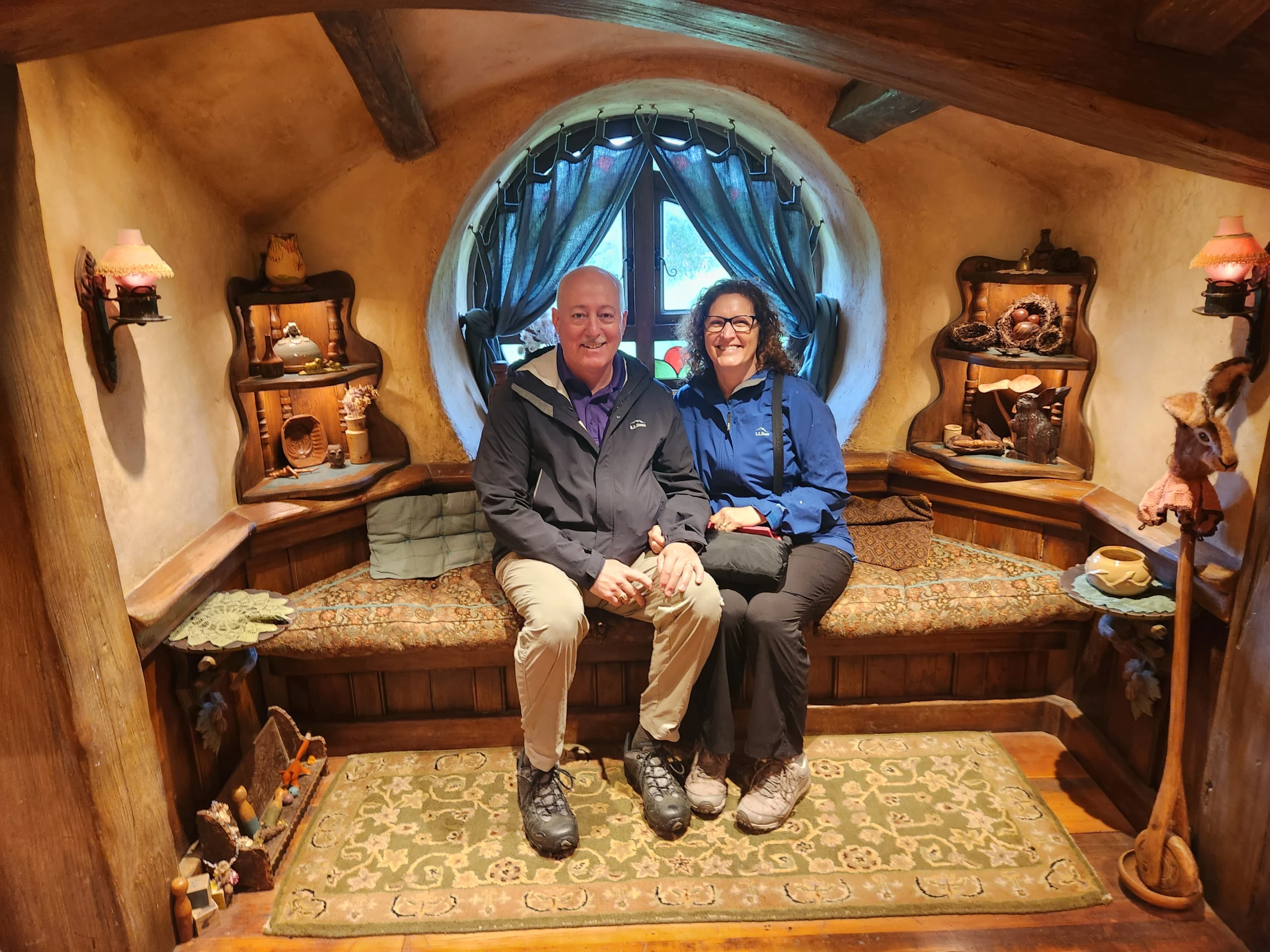 Grand Master Robert Brink and his wife sitting in hobbit-themed room.