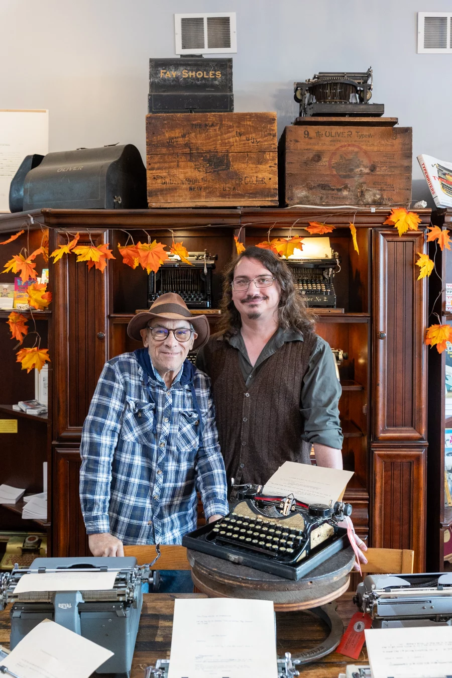 9I4A8106 Two men standing together in typewriter shop.