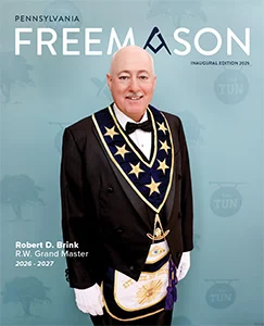 Pennsylvania Freemason cover featuring R.W. Grand Master Robert Brink in Masonic attire against a blue patterned background.