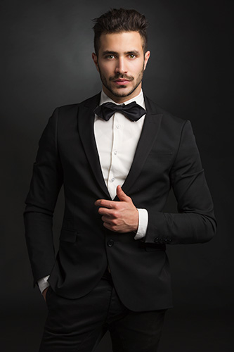 Man in suit with bow tie.