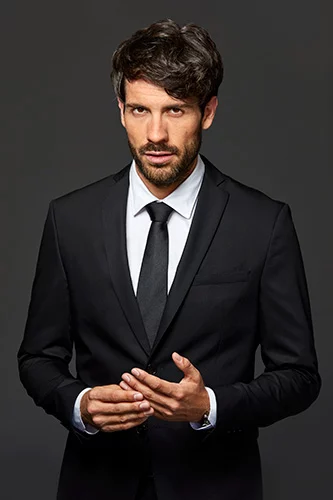 Man in dark suit and tie.