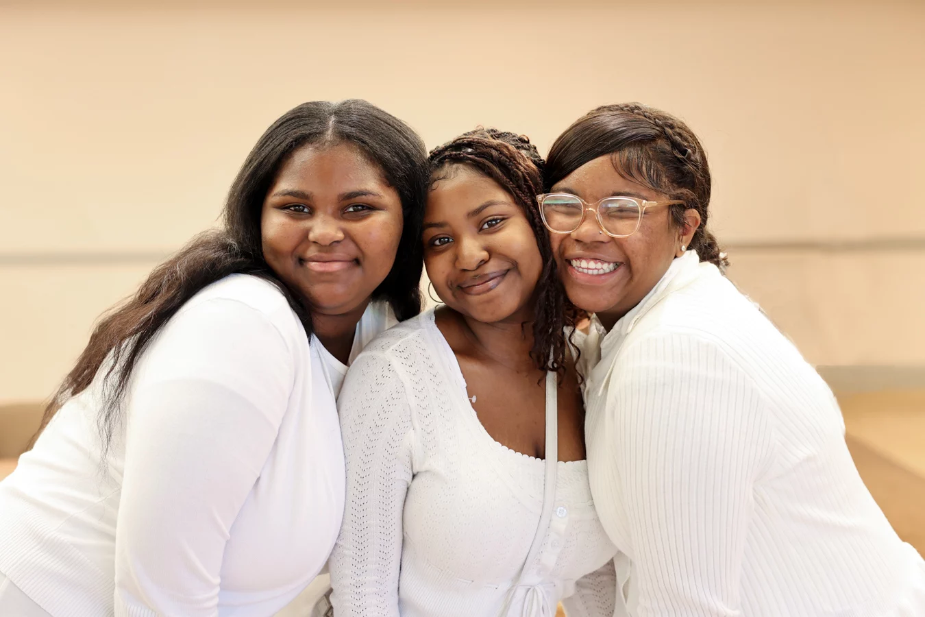 1W8A4119-Edit-Edit Smiling group of teen girls dressed in white.
