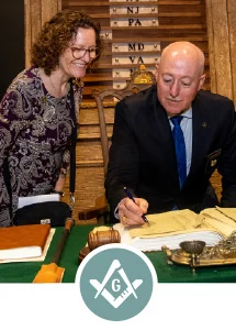 Navigate to "Freemasonry Today" in this issue. Icon shows Grand Master Robert Brink and his wife at a desk with a Square and Compasses overlaid on it.