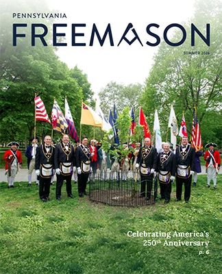 Pennsylvania Freemason Magazine cover featuring Grand Lodge Officers standing surrounding a newly planted Liberty Tree.