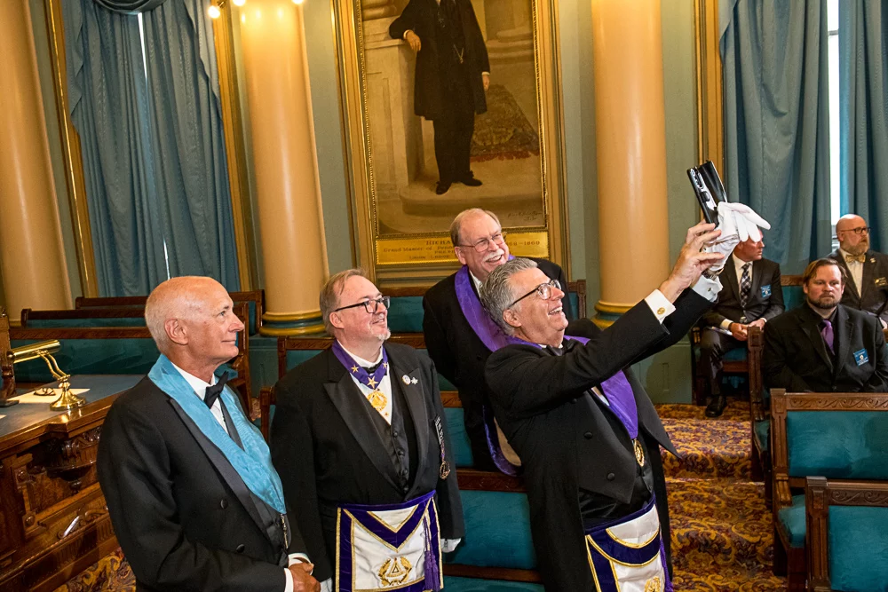 GLPANJ08.22-0108 Men in Masonic dress taking a selfie together.